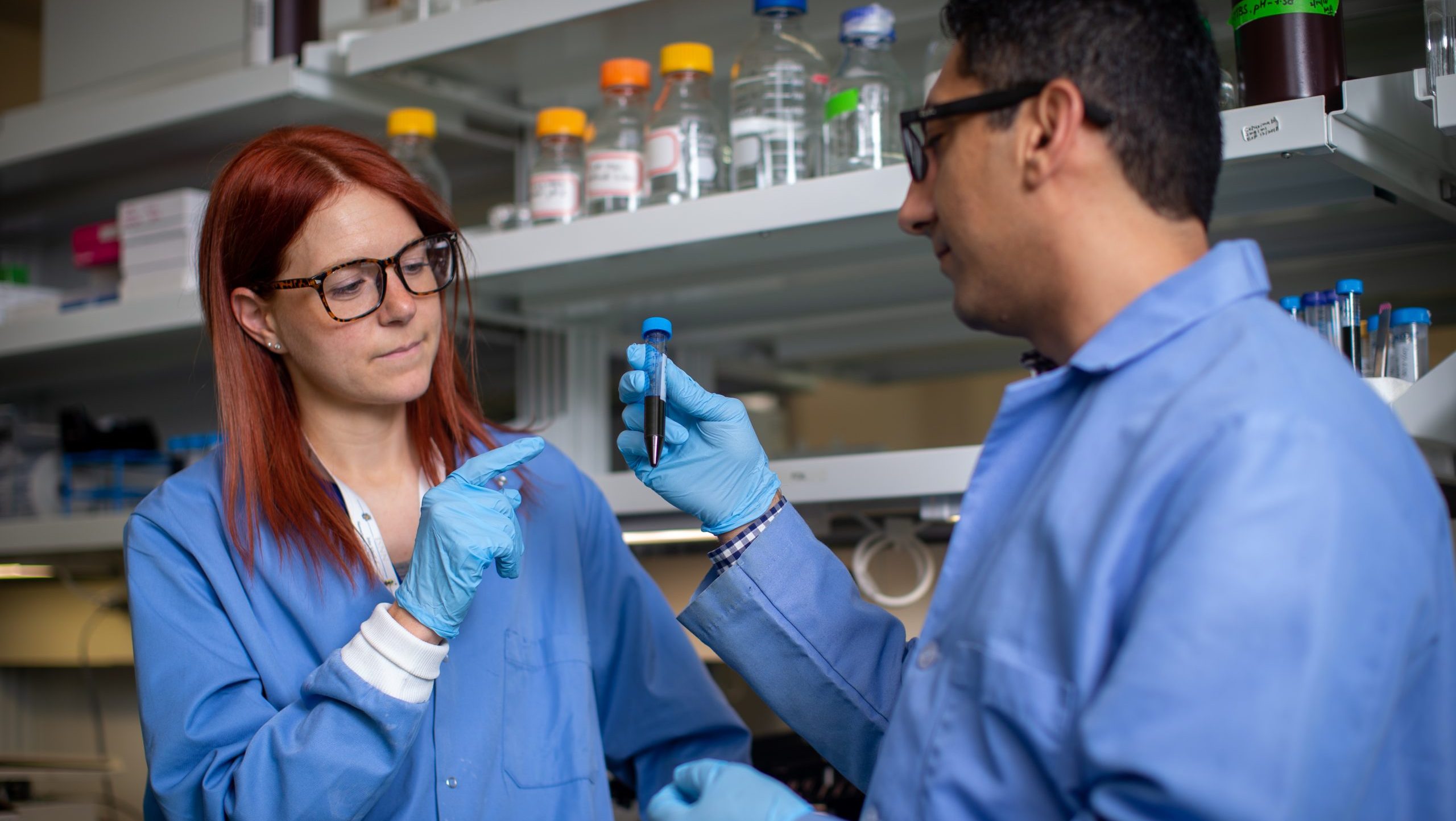 Two Nanoengineering faculty members in their research lab